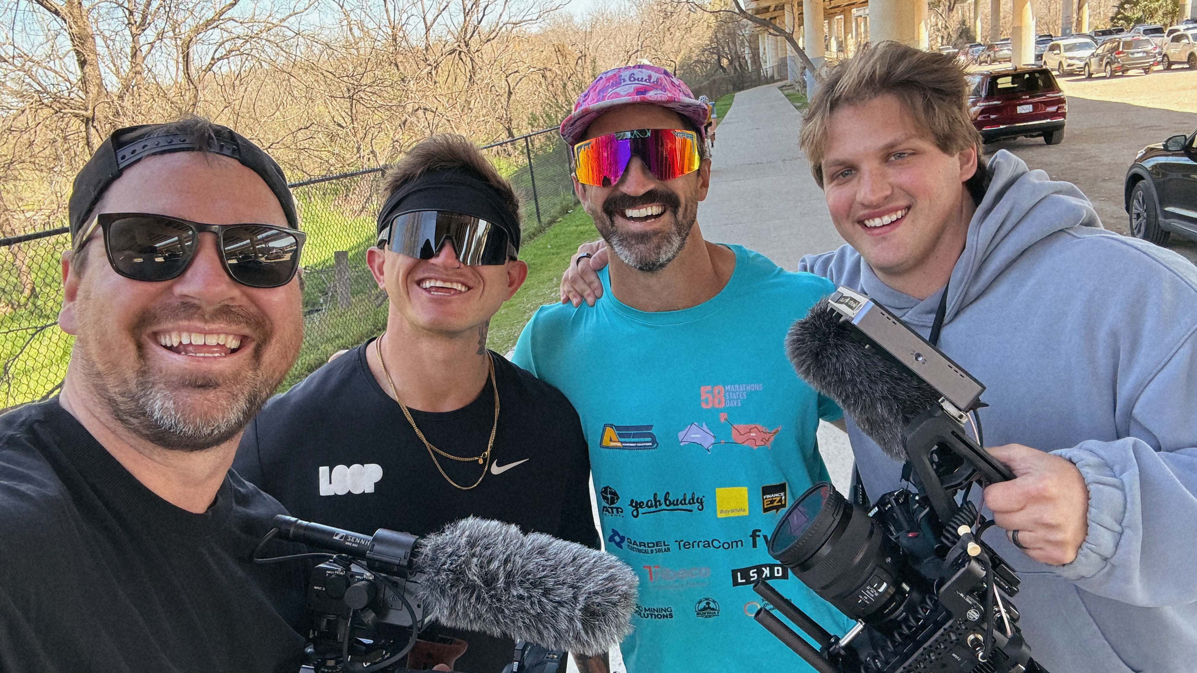 Lachlan with three people and their cameras outdoors.